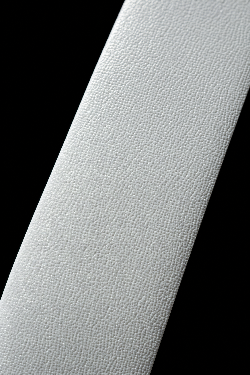 Extreme close-up of overgrip strip surface texture