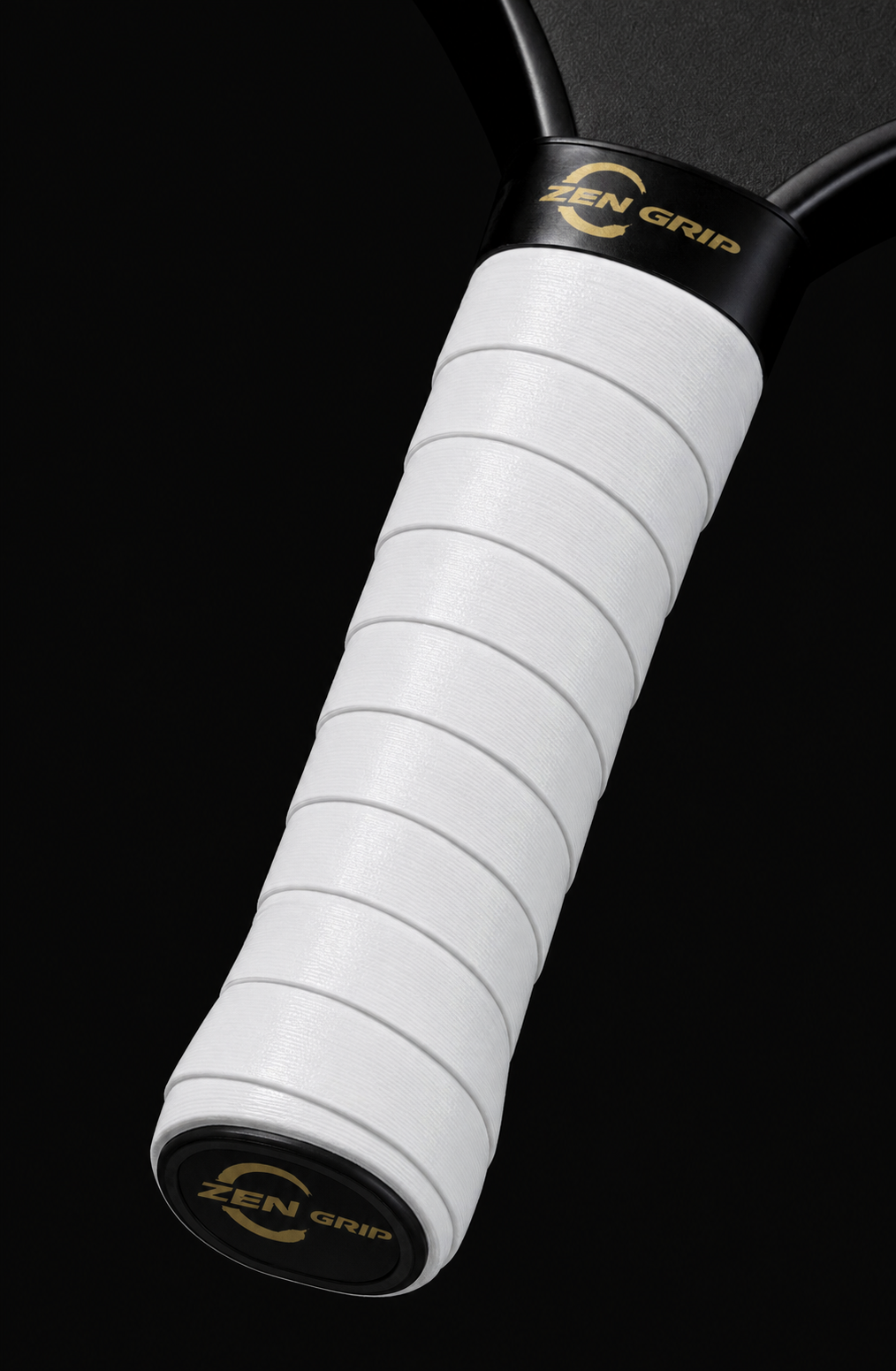 White tacky overgrip wrapped on a pickleball paddle handle