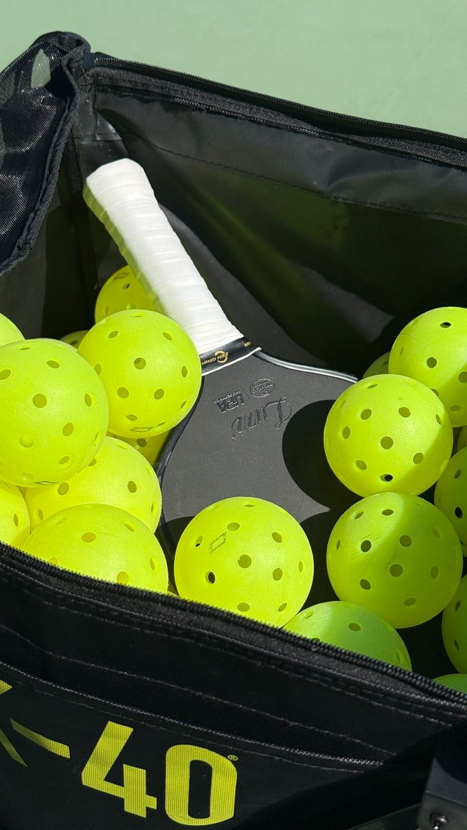Zen Grip — Premium tacky overgrip on a pickleball paddle in a bag of pickleballs